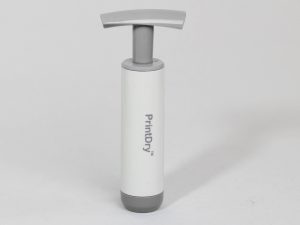 Pump for vacuum sealed filament container